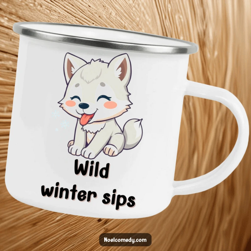 Funny camping mug showing a playful wolf pup catching snowflakes, ideal for rustic winter enjoyment.