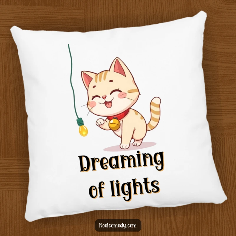 Funny Pillow with a smiling cat and bell collar chasing a dangling Christmas light, adding festive comfort.