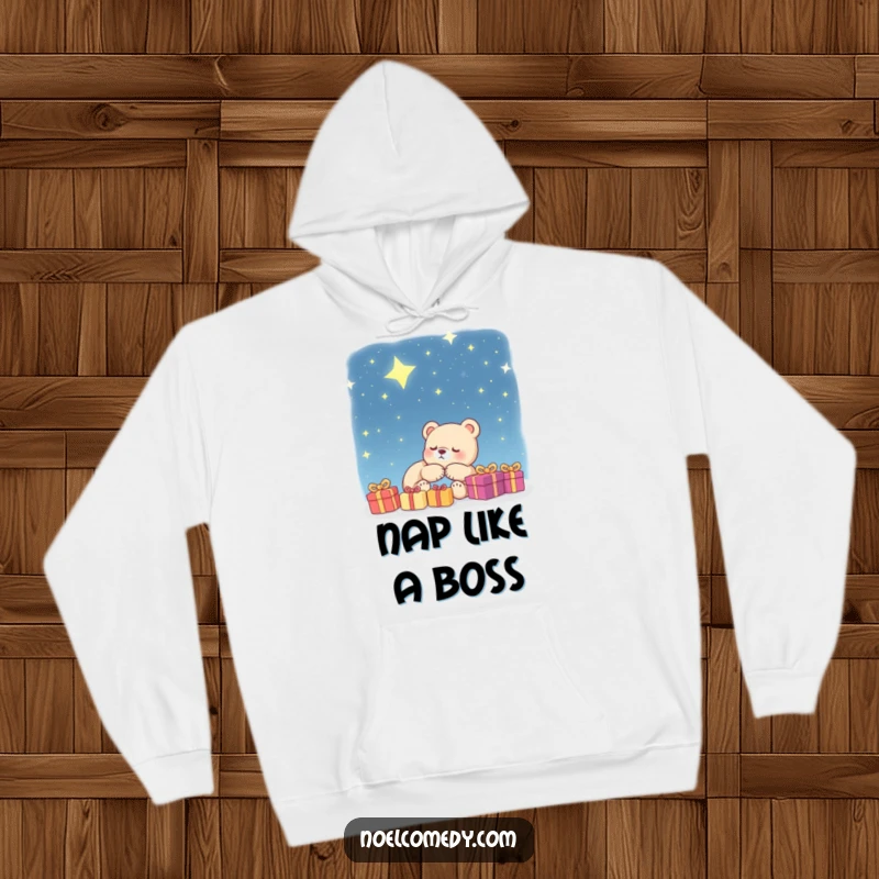 Funny Hoodie: A sleeping bear cub is depicted dreaming of presents under a beautiful starry night sky, offering cozy and humorous apparel.