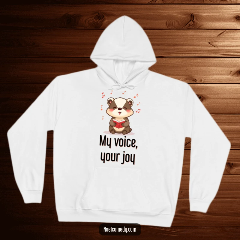 Funny hoodie featuring a badger singing carols with musical notes floating around, ideal for winter.