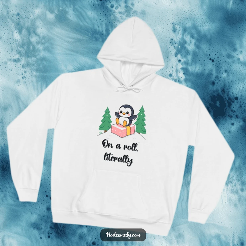 Funny hoodie print of a happy penguin character joyfully sliding down a snowy slope, using a wrapped gift as a fun sled.