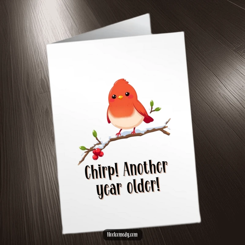 Free Printable Birthday Card: A cheerful red robin perched on a snowy branch singing happy birthday.