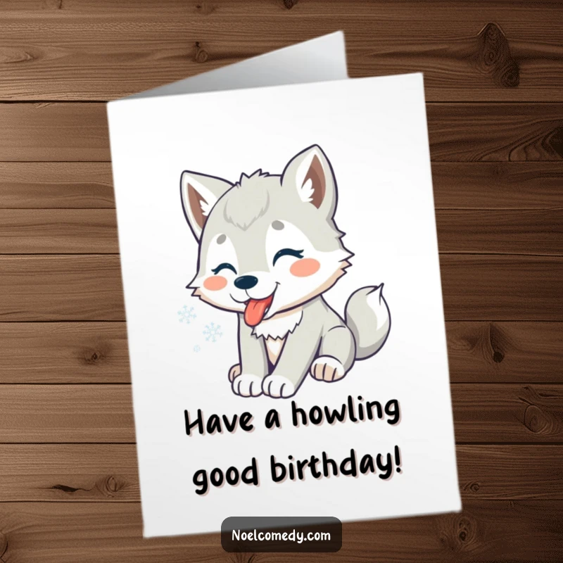 Funny Free Printable Birthday Card: A playful wolf pup joyfully catching snowflakes on its tongue, embodying wintery birthday cheer.