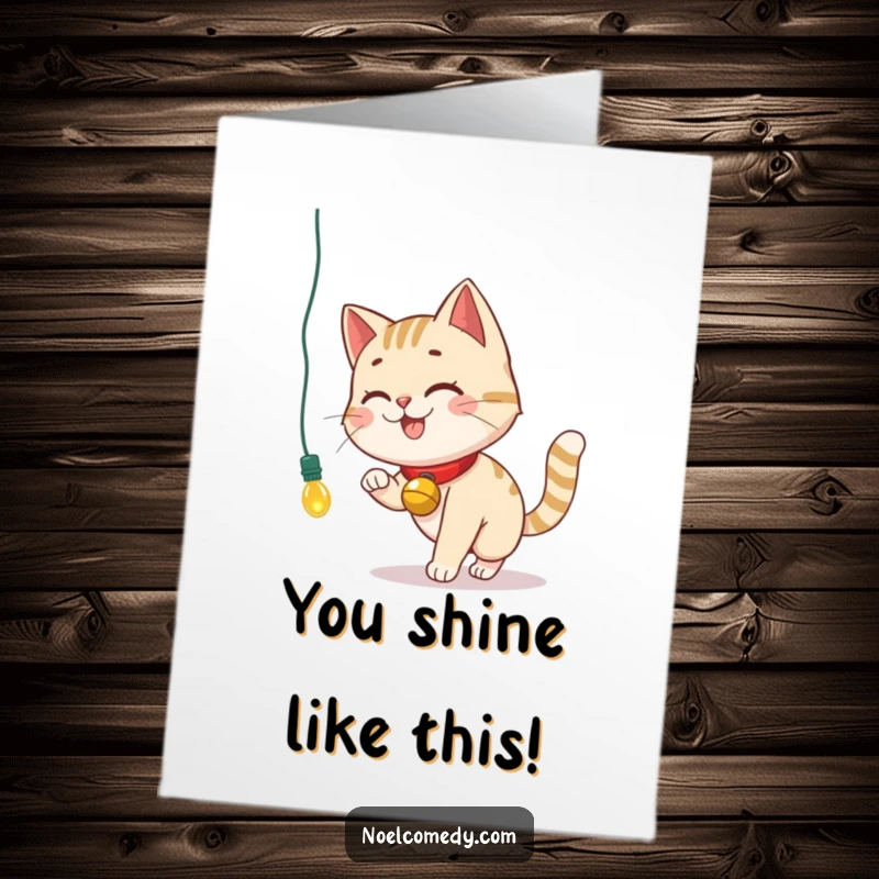 Funny Free Printable Congratulations Card: A smiling cat wearing a bell collar chases a dangling Christmas light, celebrating a bright achievement.