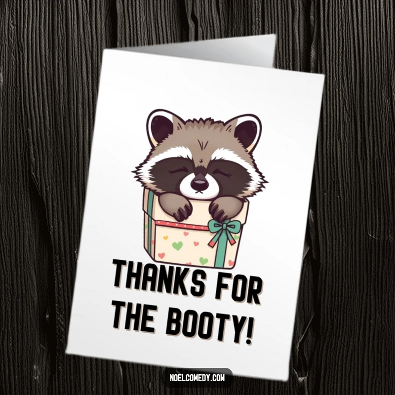 Funny Free Printable Thank You Card: A soft, sleepy raccoon nestled in a gift box, conveying warm and cozy thanks.