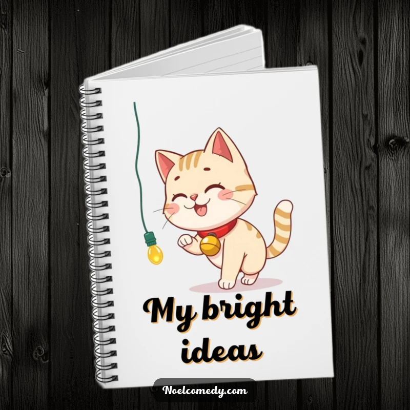 Funny Notebook cover with a smiling cat with a bell collar chasing a dangling Christmas light, ready for notes.