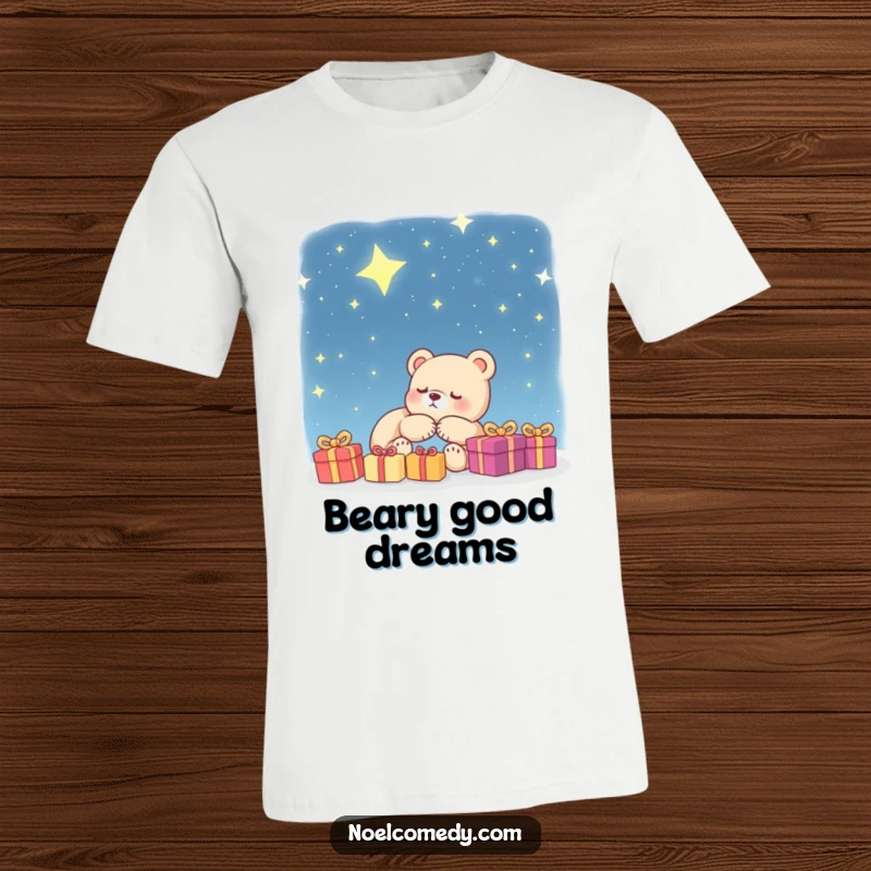Funny T-Shirt: A cute bear cub peacefully sleeps, dreaming of presents under a magical starry night sky, perfect for sleepyheads.