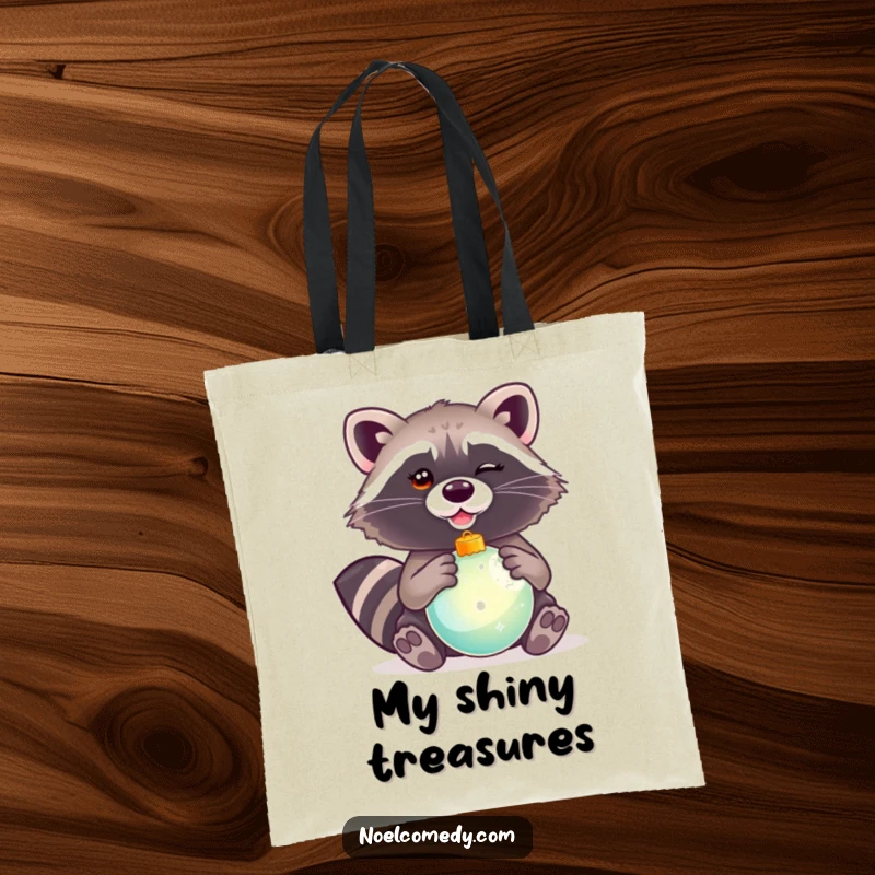 Funny tote bag showcasing a winking raccoon holding a shiny Christmas ornament, ideal for holiday shopping.