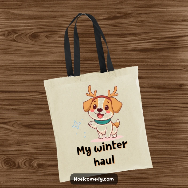 Funny Tote Bag showing a happy dog in a reindeer headband chasing a snowflake, ideal for carrying.